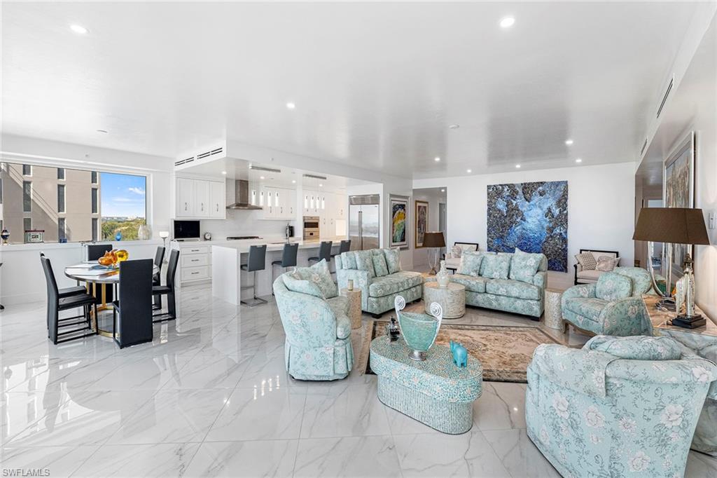 Living room featuring glossy white tile floors.