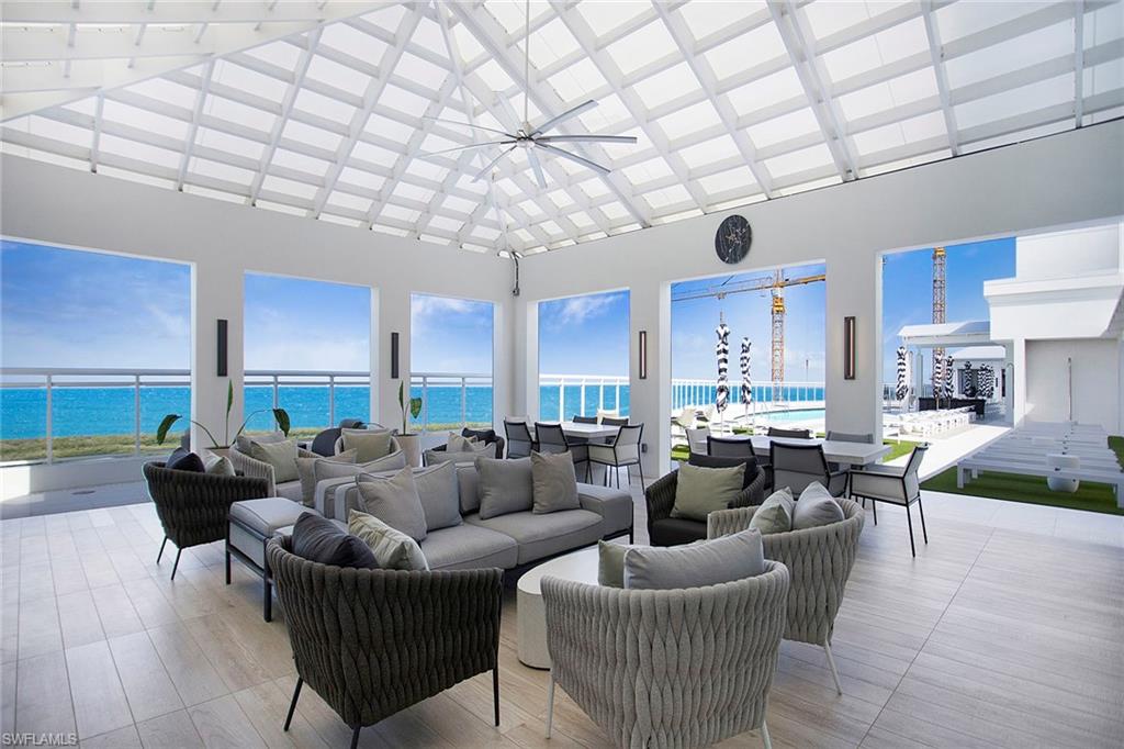 View of rooftop patio / terrace with an outdoor hangout area, ceiling fan, a water view, and outdoor dining area