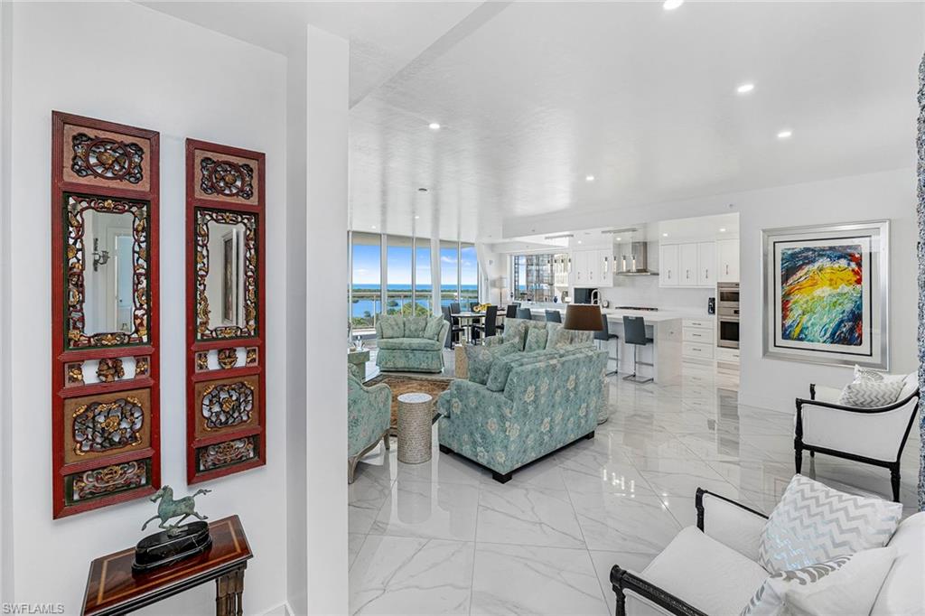 Expansive living room with bright white floors.