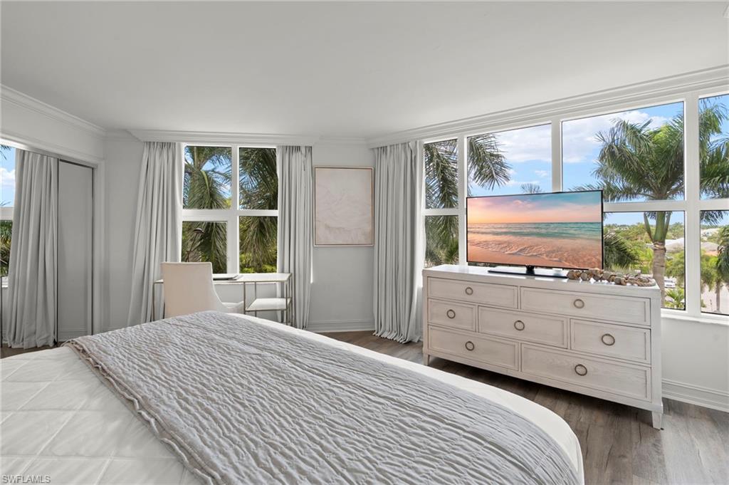 Primary bedroom boasts large windows making it light and bright