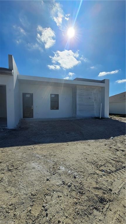 View of front facade with stucco siding