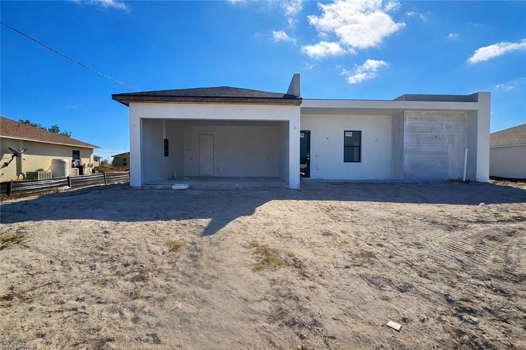 View of front of property featuring stucco siding