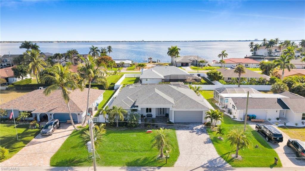 Aerial view of residential area with a large body of water