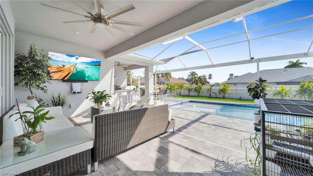 View of swimming pool with a patio, a lanai, a sunroom, and an outdoor hangout area