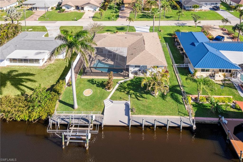 Aerial perspective of suburban area with a nearby body of water