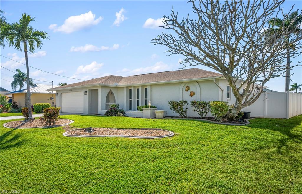 Ranch-style home featuring stucco siding and an attached garage