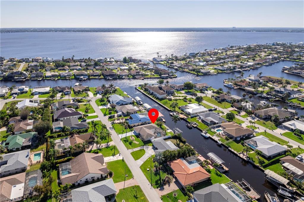 View of property location featuring nearby suburban area and a nearby body of water