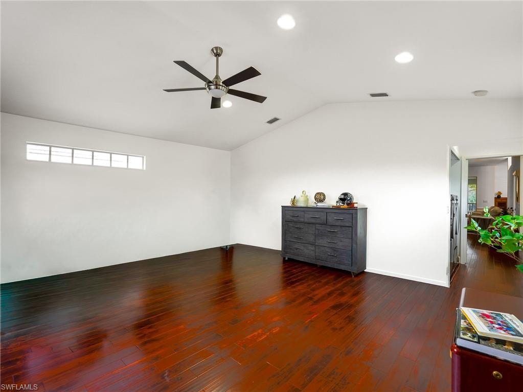 Bonus Room with dark wood finished floors, ceiling fan, vaulted ceiling, and recessed lighting