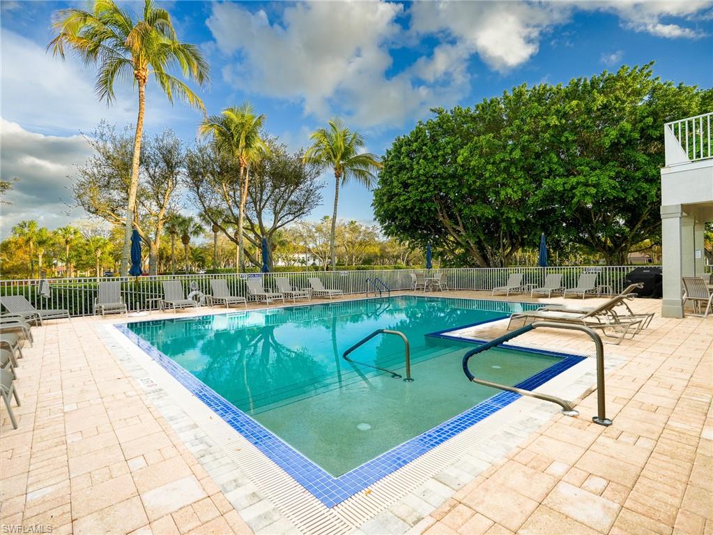 Community pool with a patio