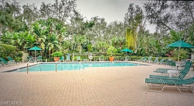Community pool with a patio area