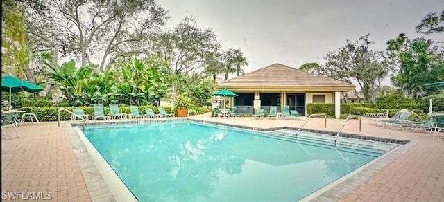 Community pool featuring a patio area