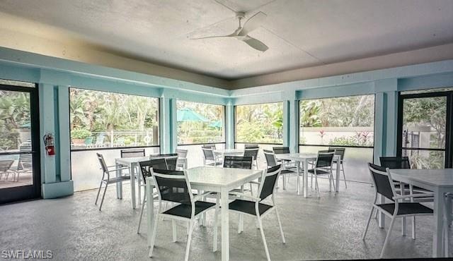 Sunroom / solarium with plenty of natural light and a textured ceiling