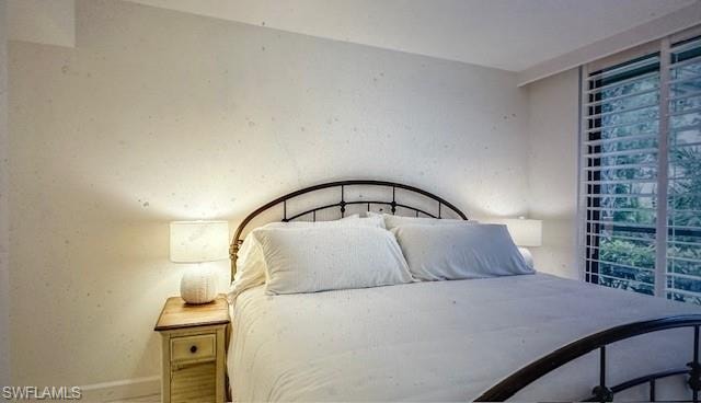 Bedroom featuring baseboards