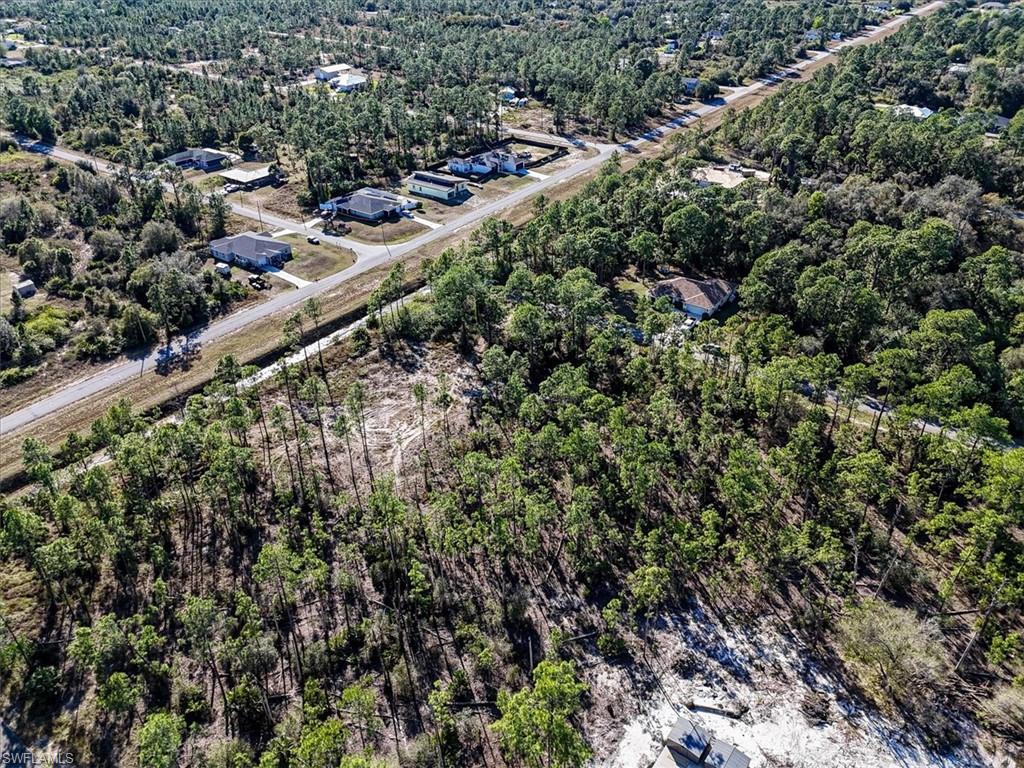 Aerial overview of property's location featuring a forest