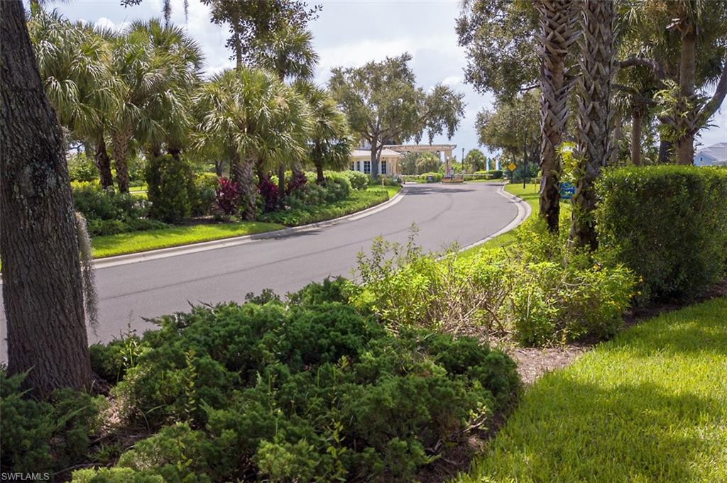 View of asphalt street featuring curbs