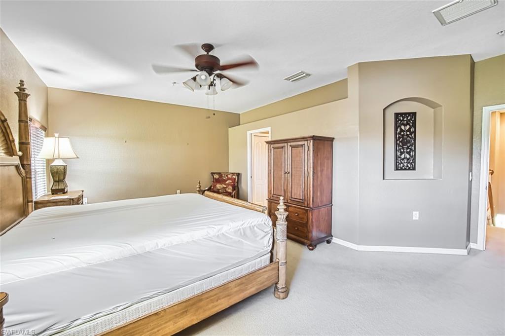 Bedroom with carpet floors and a ceiling fan