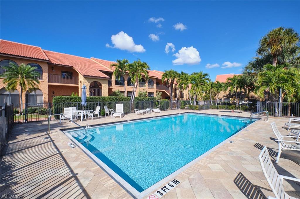 Community pool with a patio area