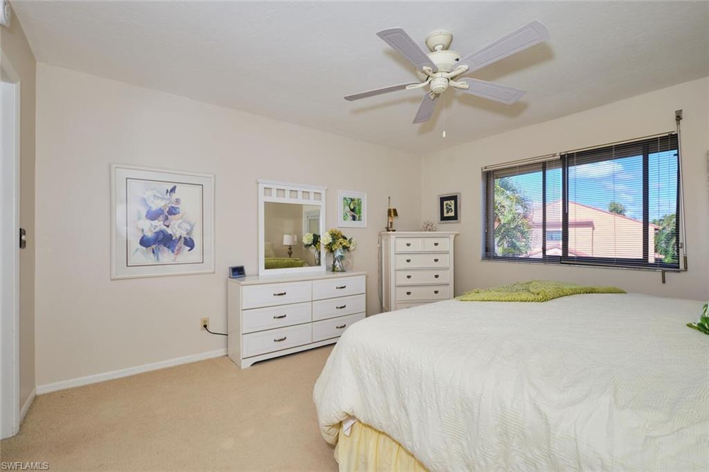 Bedroom with light carpet and ceiling fan