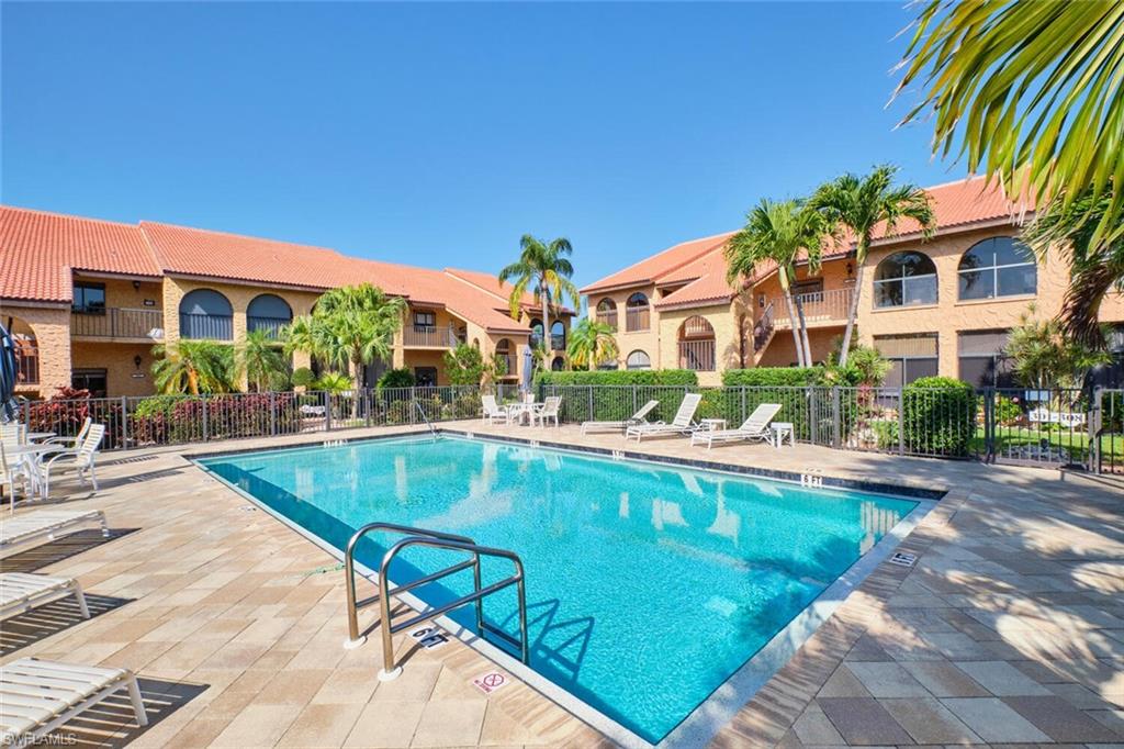 Community pool featuring a patio