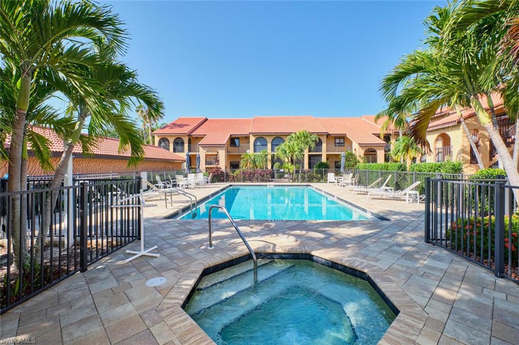 Community pool featuring a patio area and a community hot tub