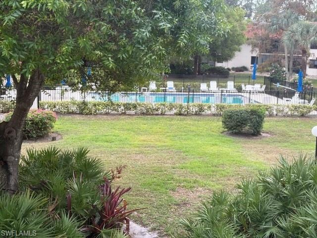 View of yard with a community pool