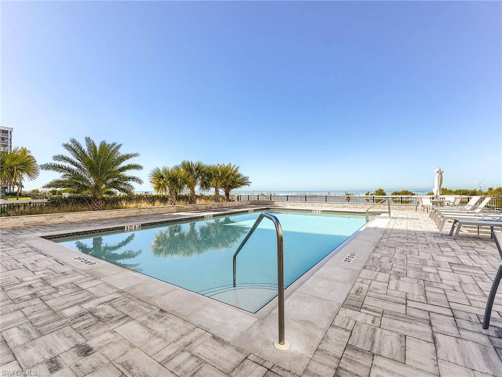 Community pool with a patio