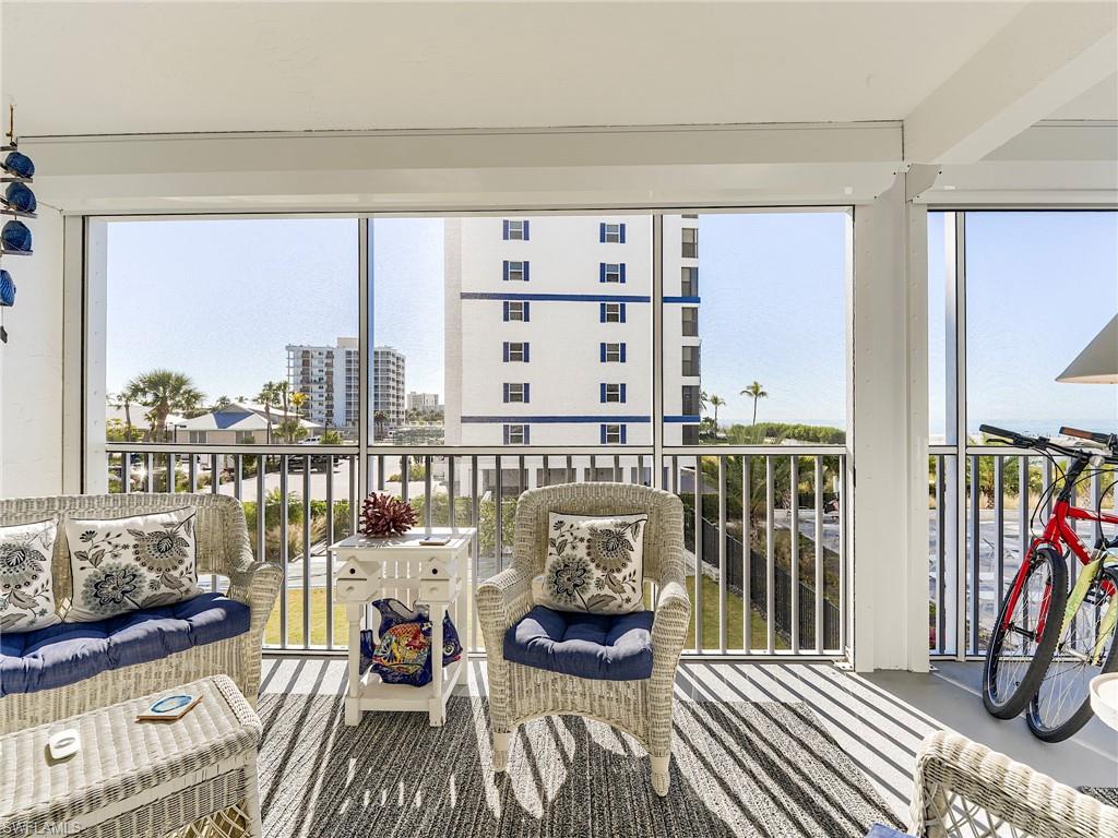 Balcony with a sunroom and an outdoor living space