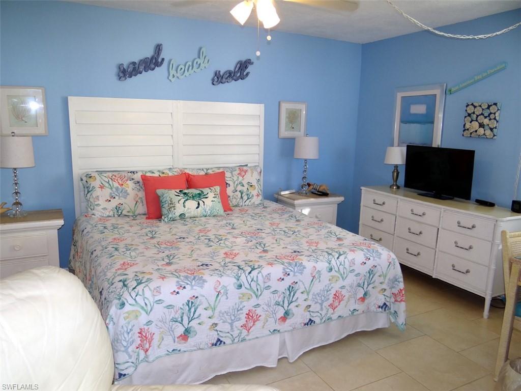 Bedroom featuring a ceiling fan and light tile patterned flooring