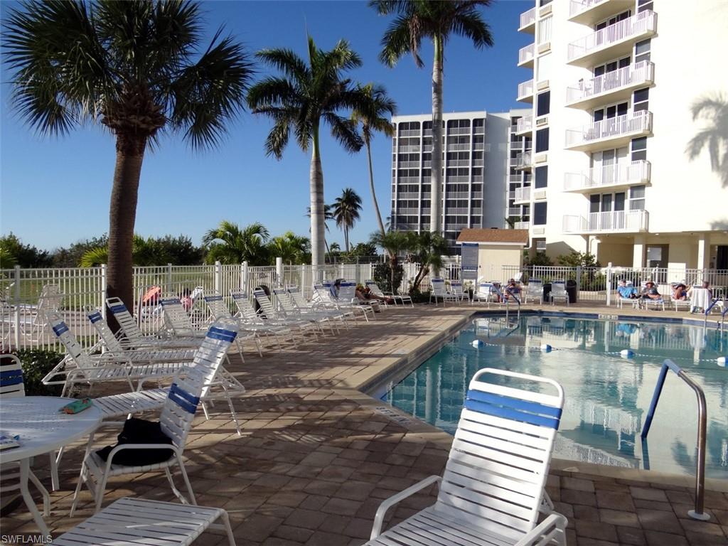Community pool with a patio