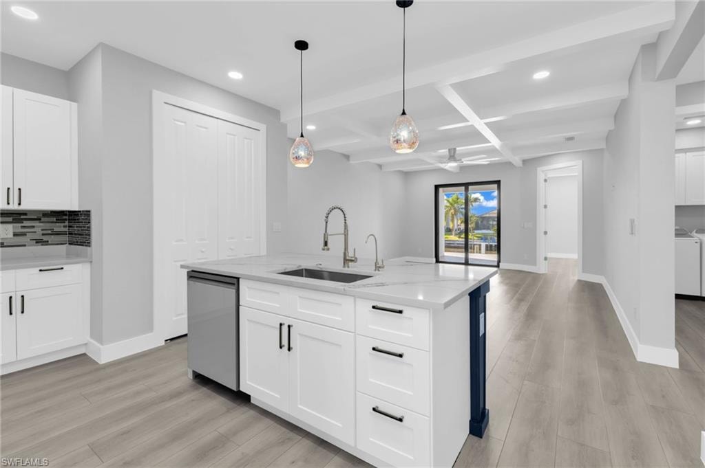 Kitchen featuring decorative backsplash, recessed lighting, white cabinetry, coffered ceiling, and pendant lighting