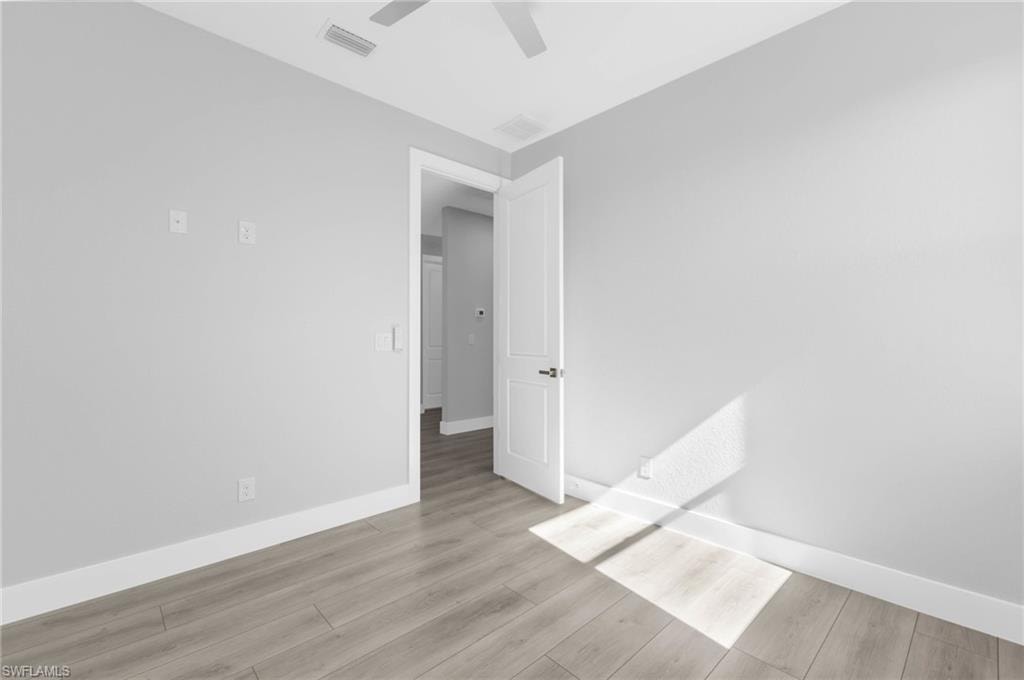 Unfurnished bedroom with light wood-type flooring and a ceiling fan