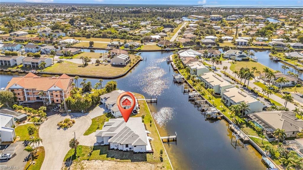 Aerial perspective of suburban area with a large body of water