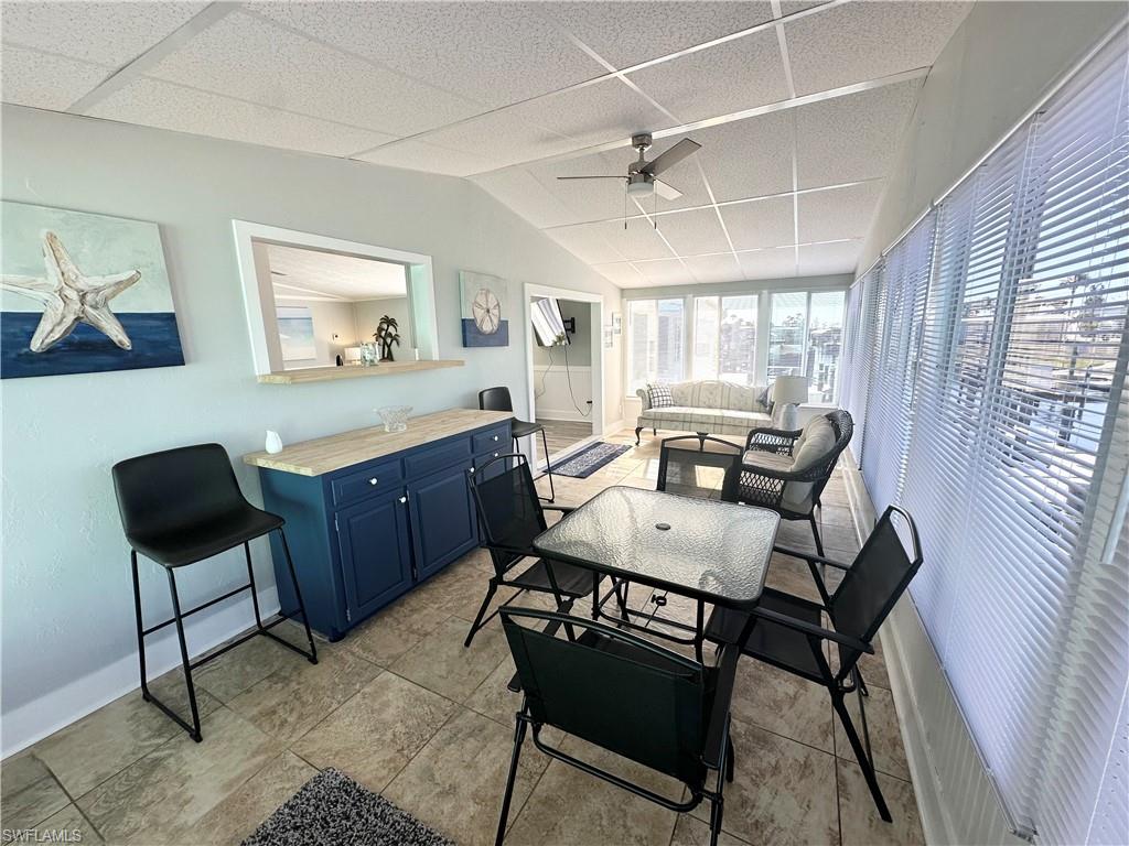 Florida room with pass-through window to kitchen