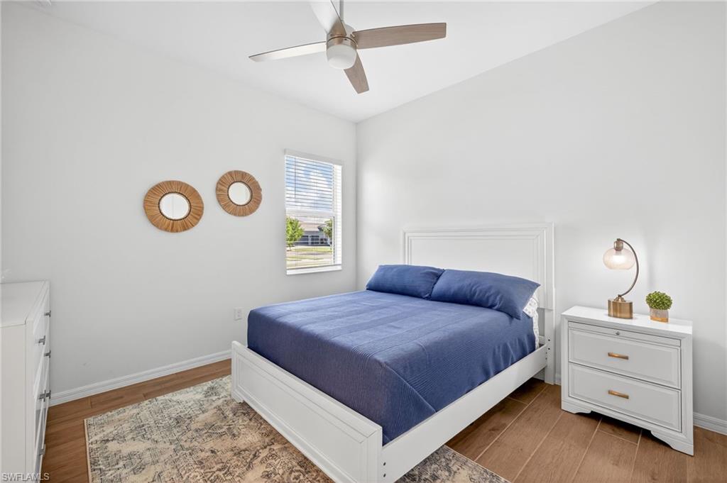 Bedroom featuring light wood-type flooring and ceiling fan