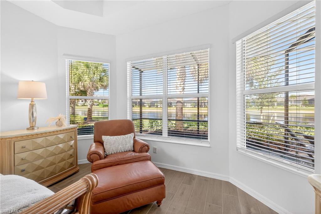 Living area with wood finish floors and baseboards