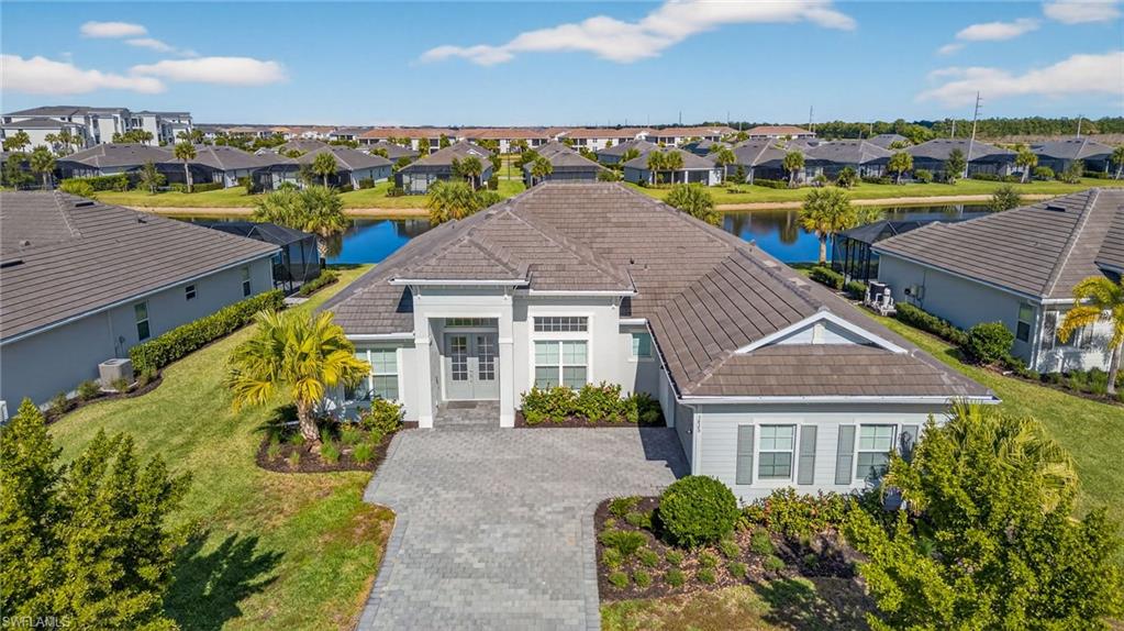Aerial perspective of suburban area with a large body of water
