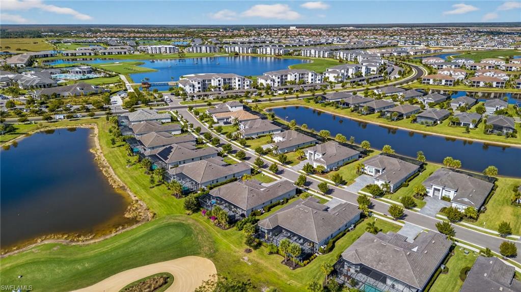 Aerial overview of property's location with nearby suburban area and a nearby body of water