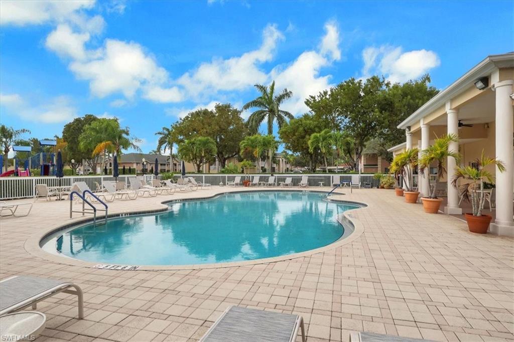 Community pool featuring a patio