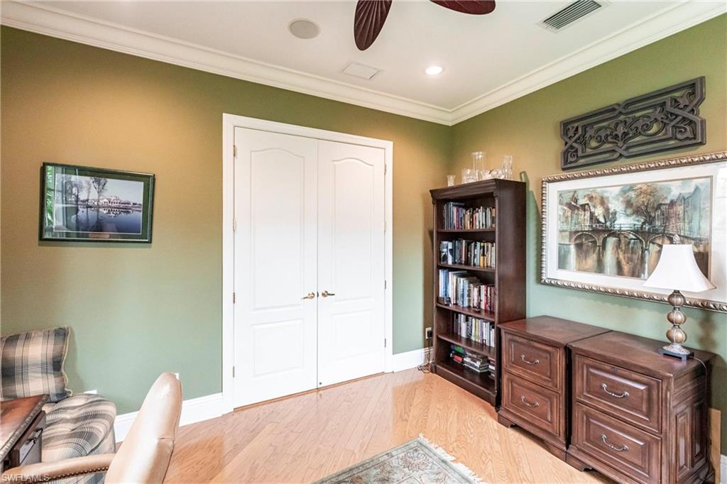 Office featuring ornamental molding, light wood-style flooring, a ceiling fan, and recessed lighting