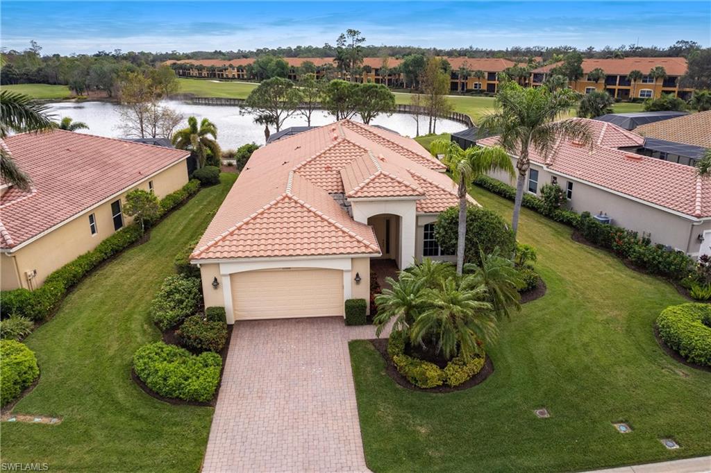 Aerial perspective of suburban area featuring a large body of water