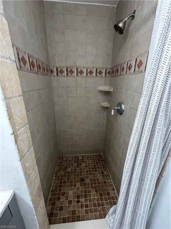 Bathroom featuring a shower with curtain