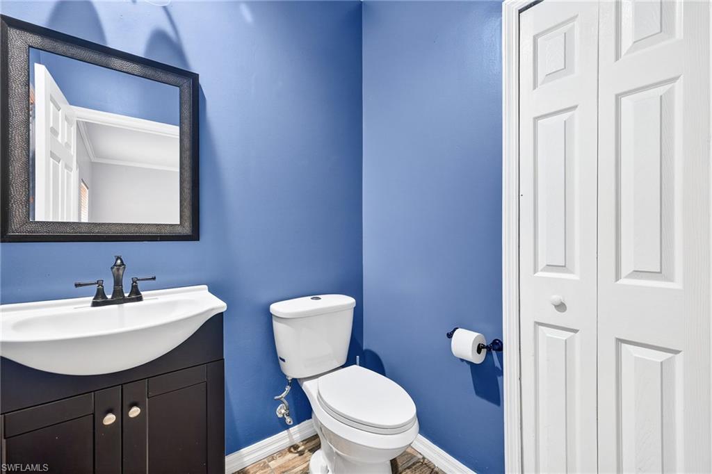 Half bath with vanity and toilet