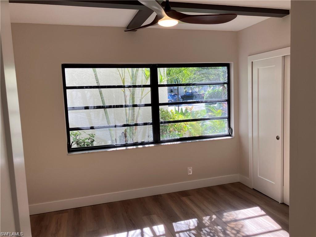 Spare room featuring a ceiling fan and wood finished floors