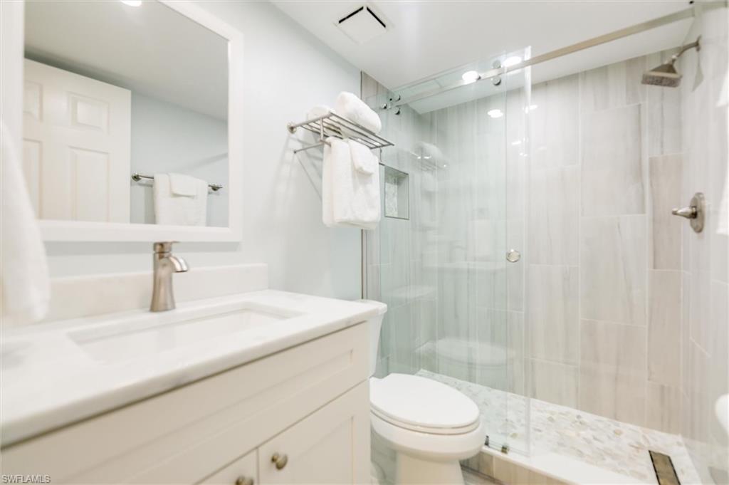Bathroom with vanity and a stall shower