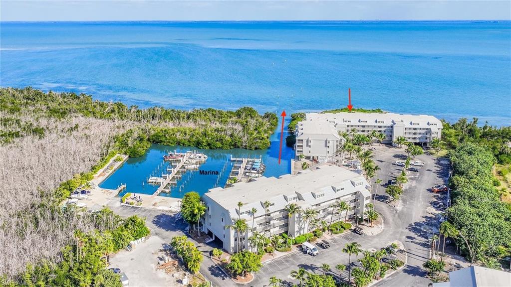 Drone / aerial view of a large body of water and a marina