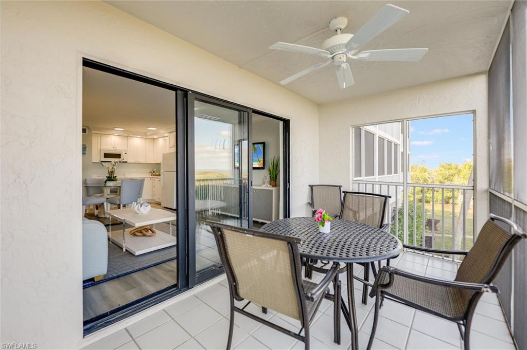 Sunroom / solarium with ceiling fan, outdoor dining area, and plenty of natural light