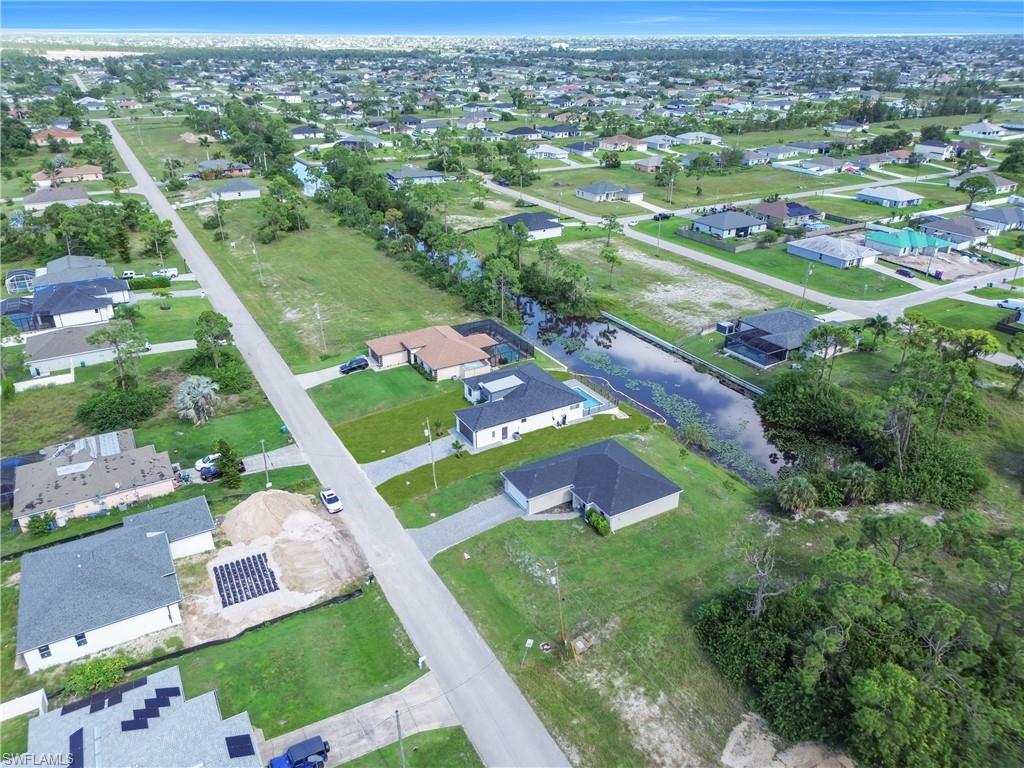 View of property location with nearby suburban area