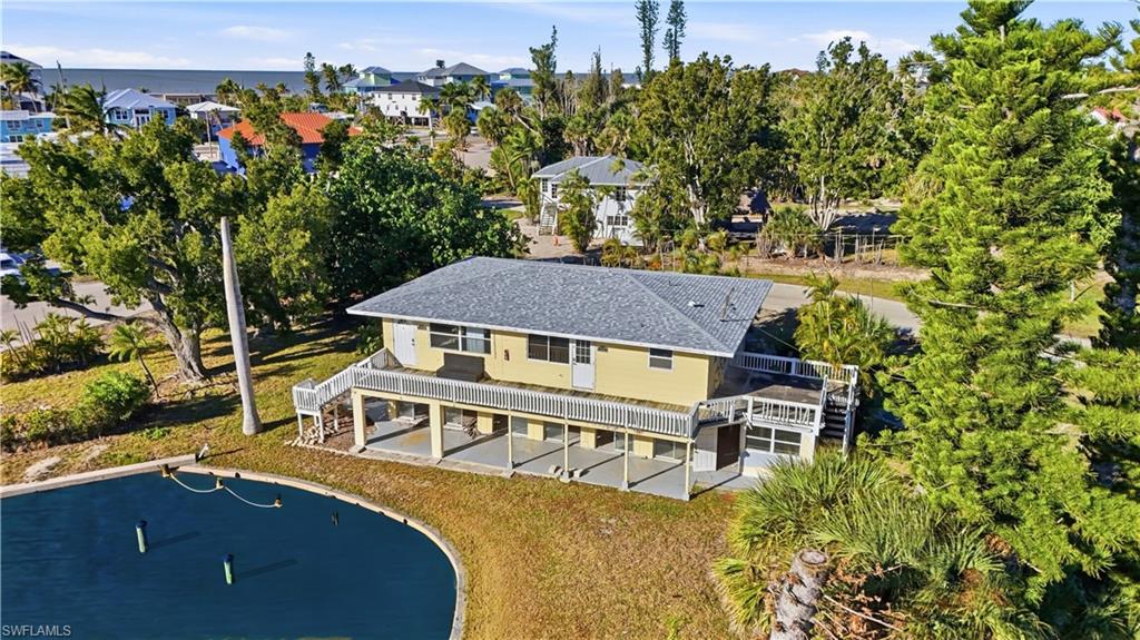 Aerial perspective of suburban area featuring a tree filled landscape - Virtually Edited Image