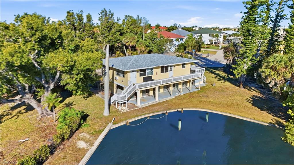 Aerial overview of property's location featuring a large body of water - Virtually Edited Image