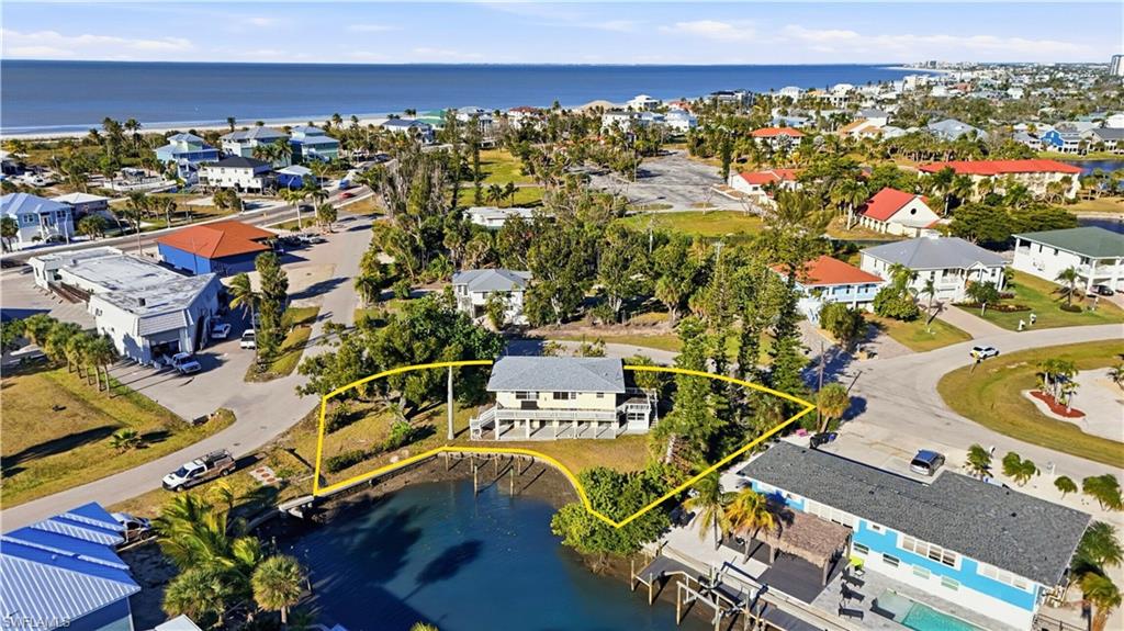 Aerial view of residential area with a large body of water